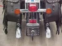 large mud flap with center concho and studs